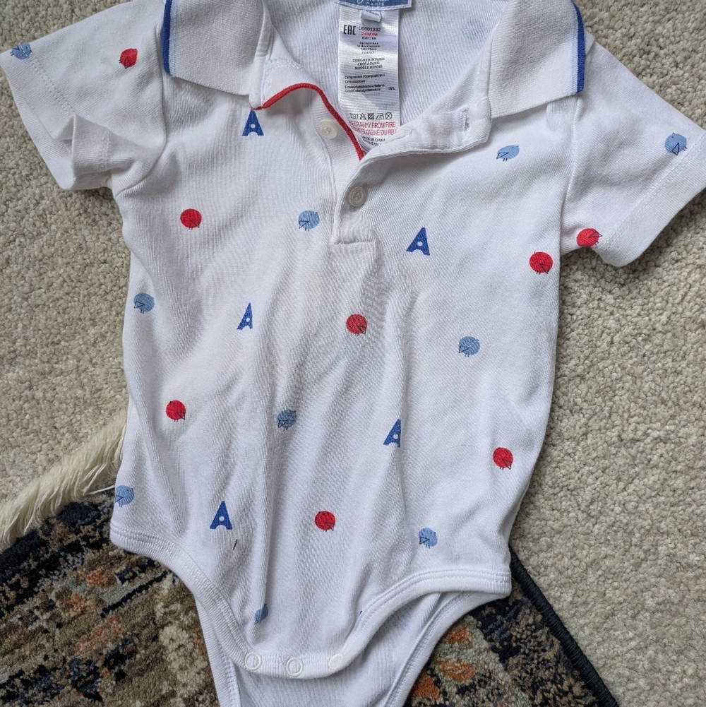 White Baby Onesie with Red and Blue Accents